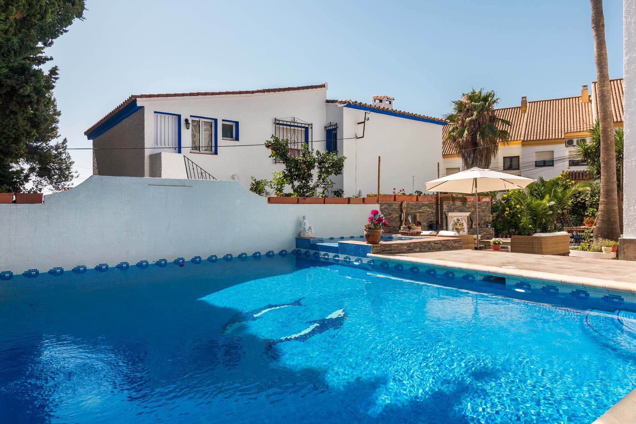 Pool area and house